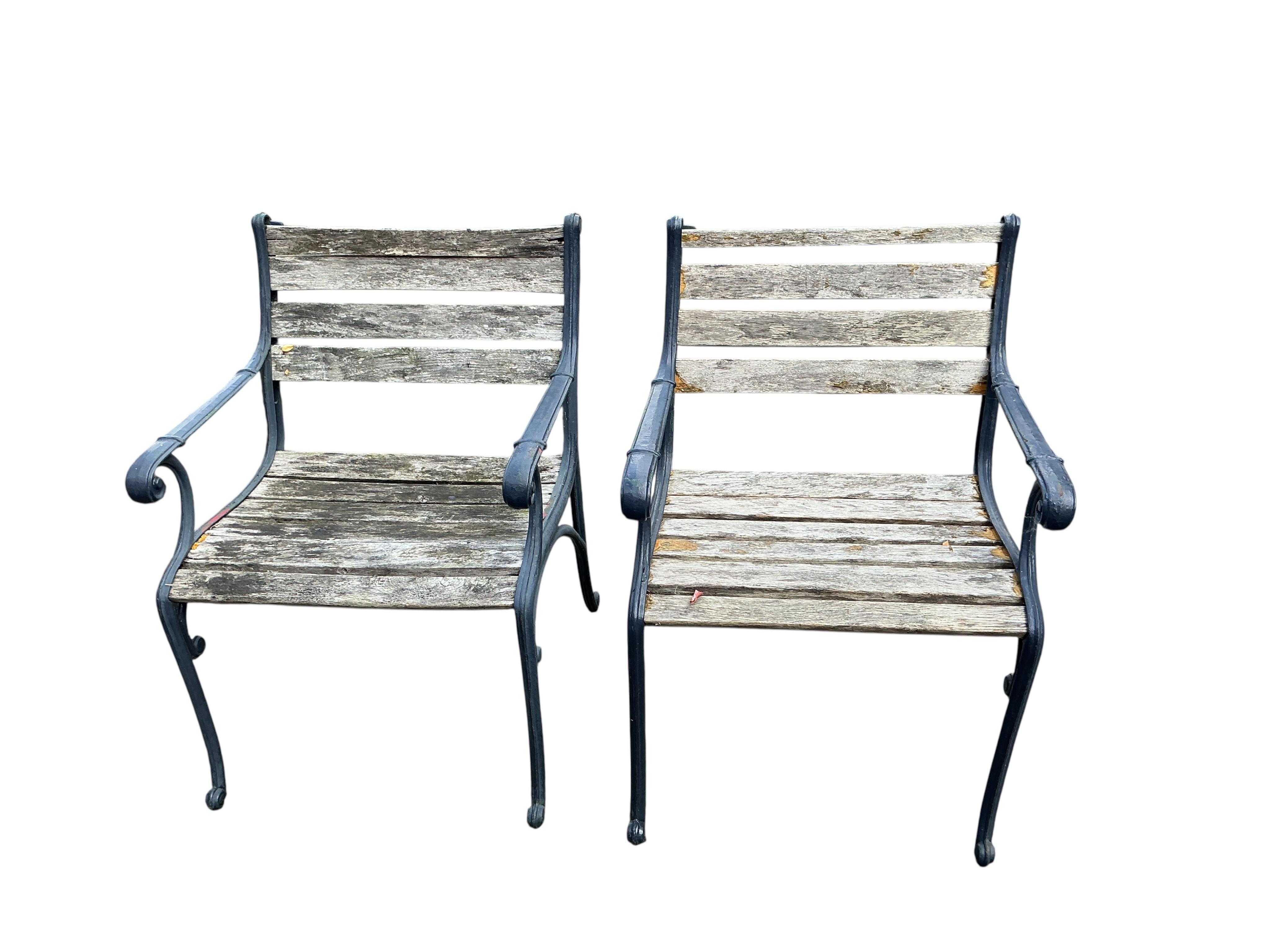 A cast metal slatted garden bench, width 115cm, together with three matching garden armchairs and four bench ends